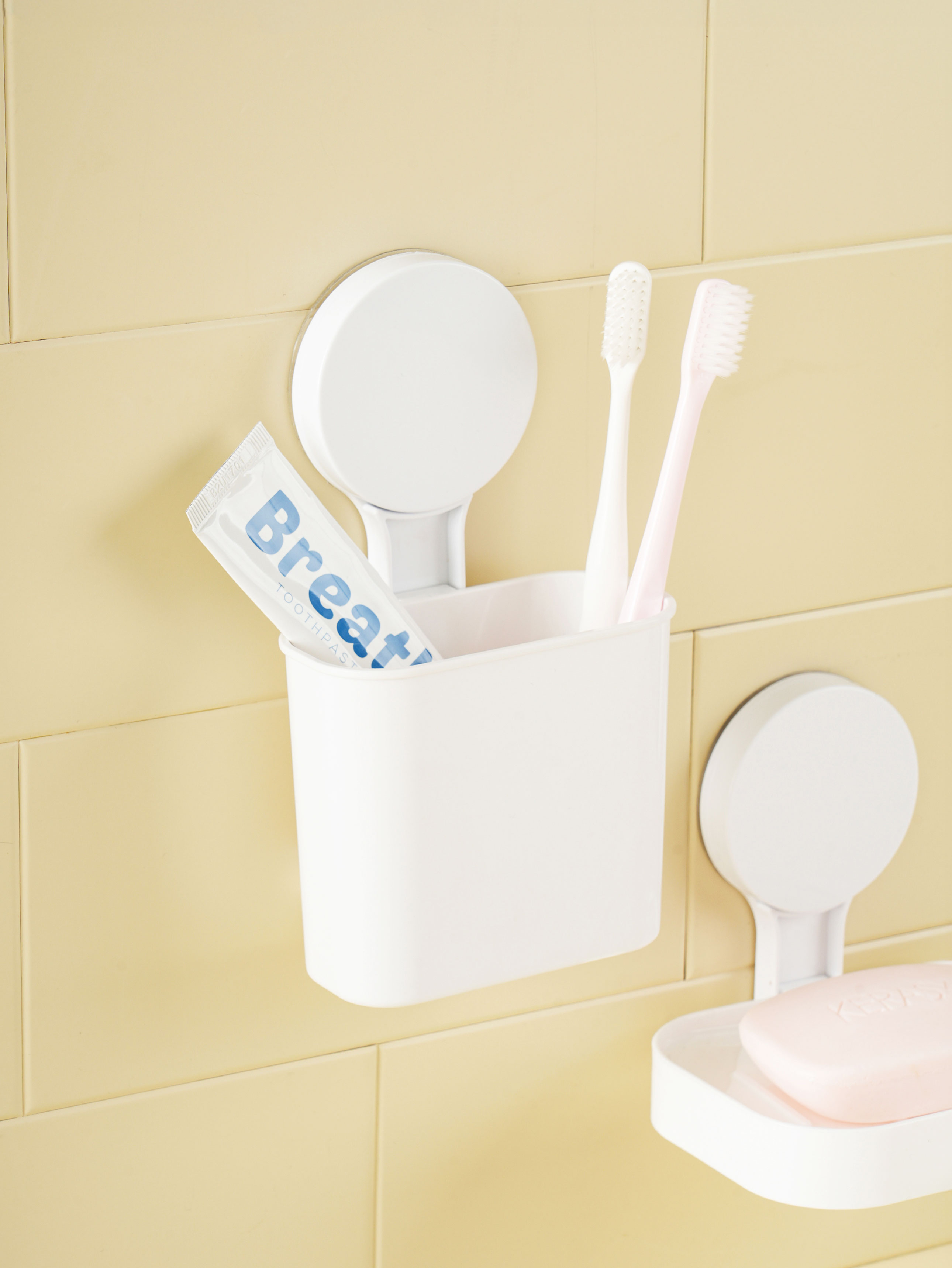 Non-perforated adhesive bathroom storage box