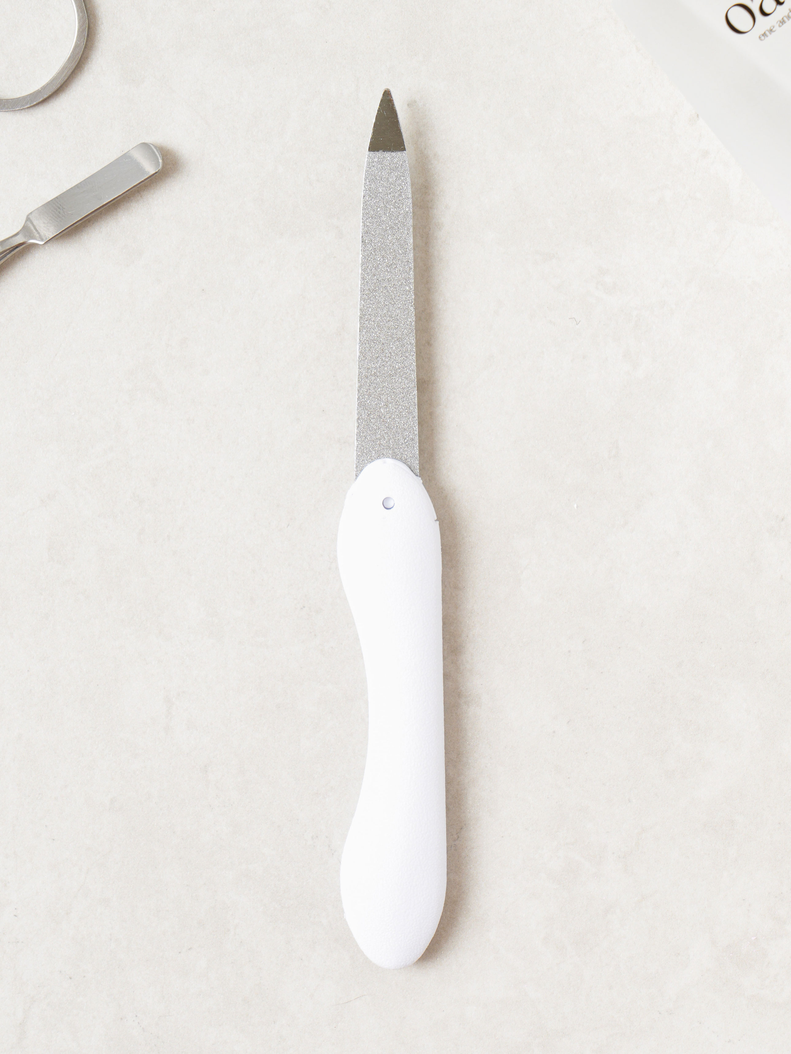 Folding stainless steel nail file
