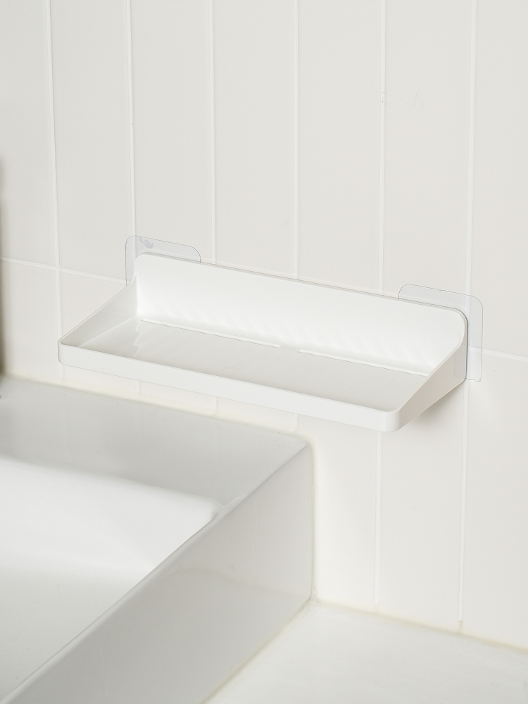 Attachable drainable bathroom storage shelf