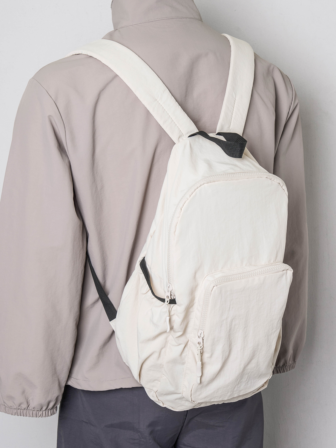 Nylon lightweight front pocket backpack ivory
