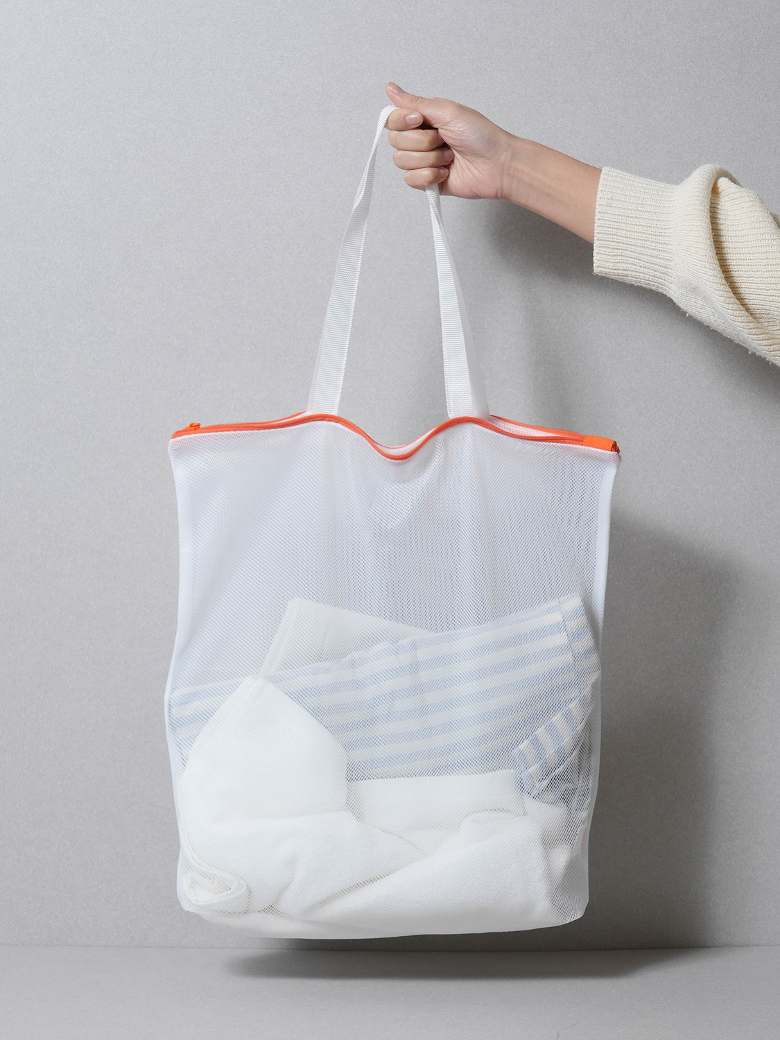 Mesh tote bag that doubles as a travel laundry net