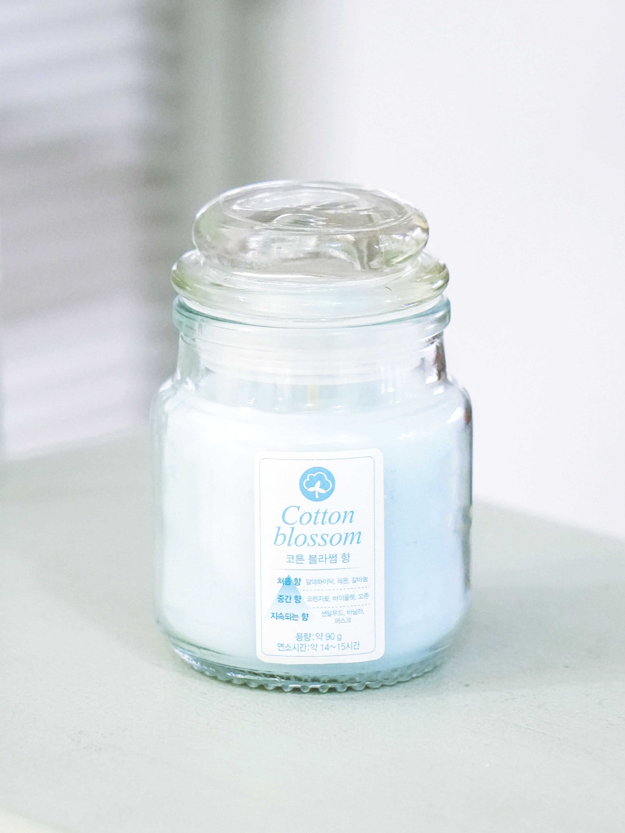 Glass stopper colored candle 90 g (cotton scent)