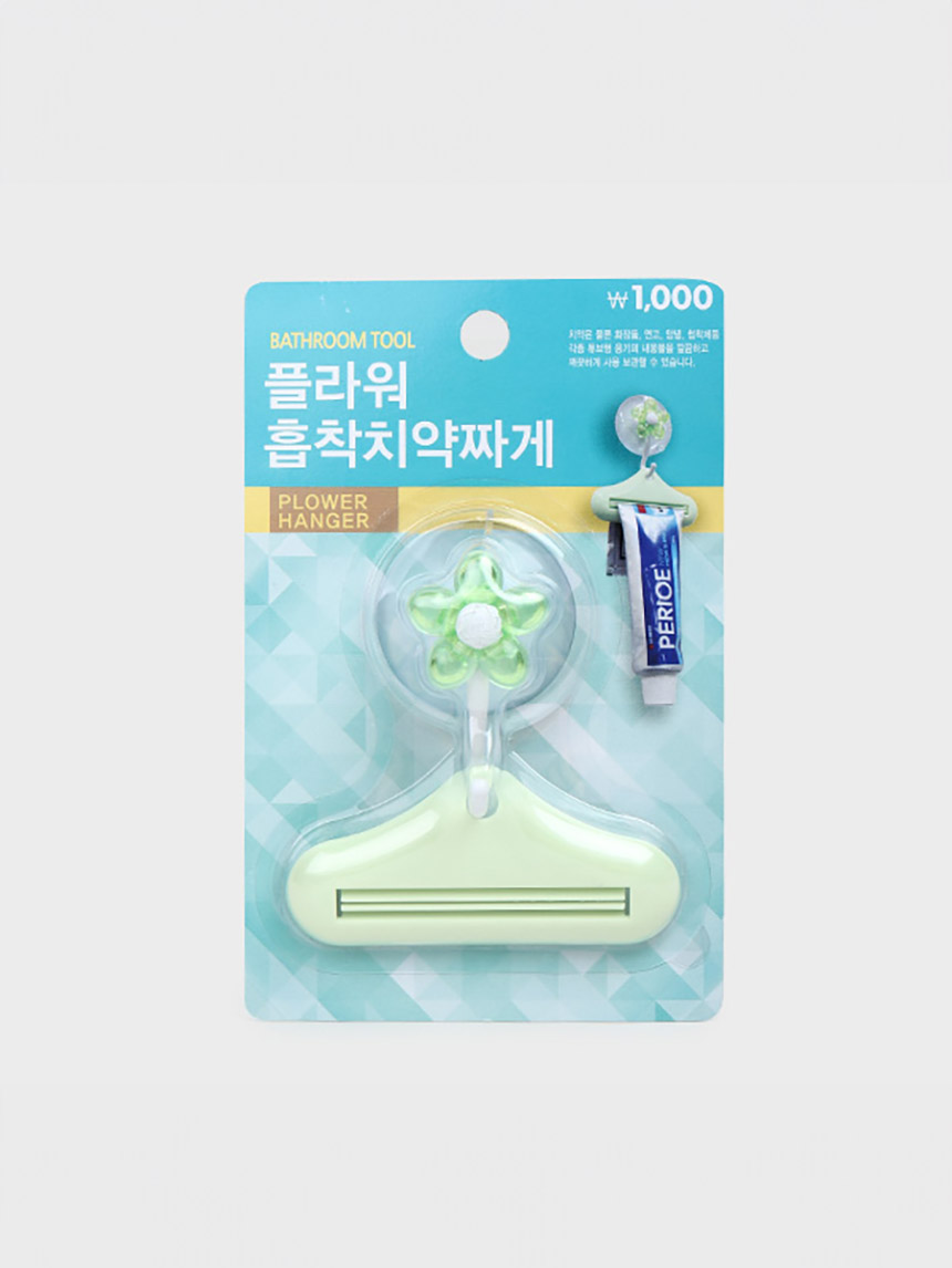 Flower suction toothpaste squeezer