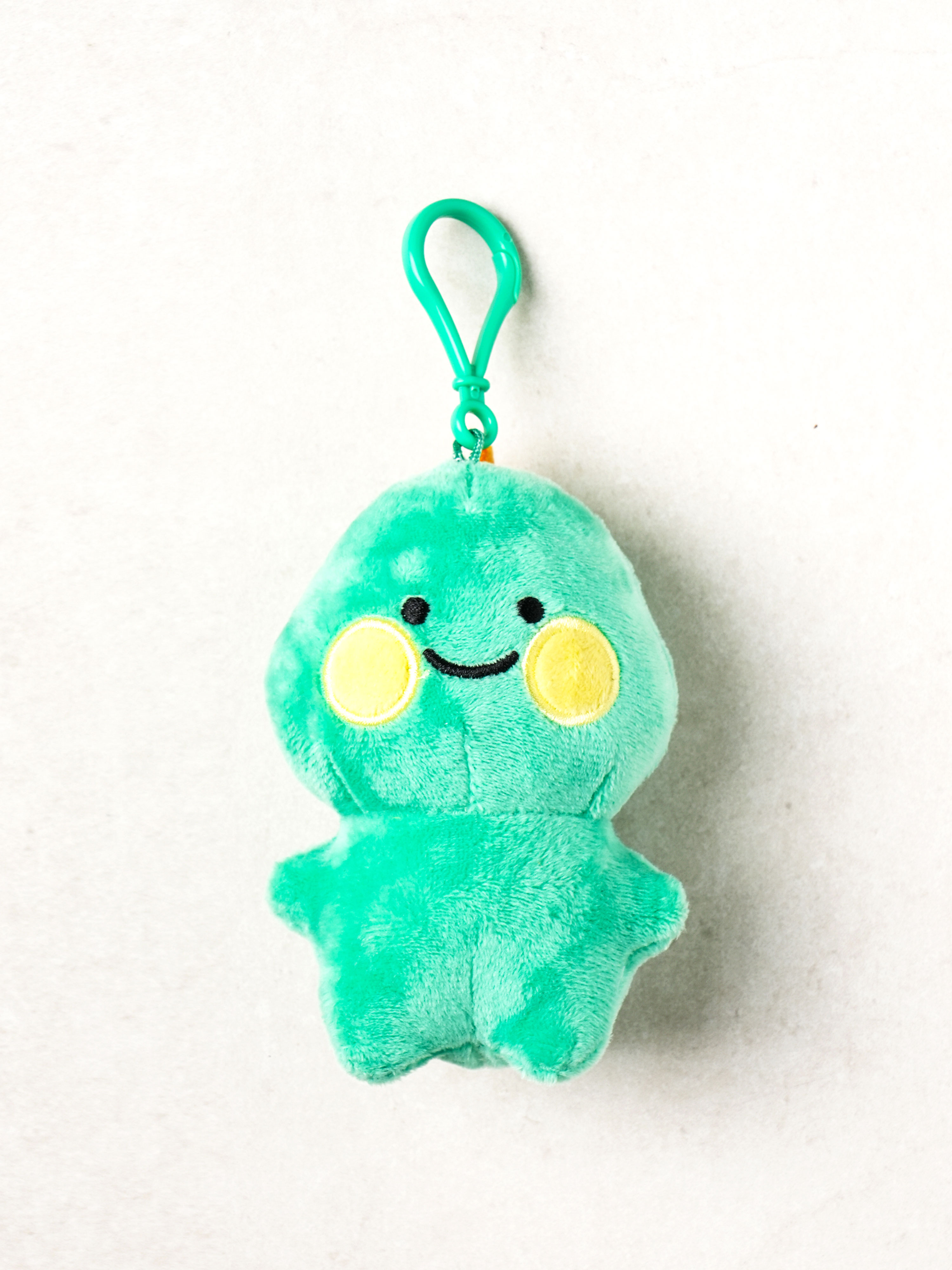 Green round dinosaur hanging doll