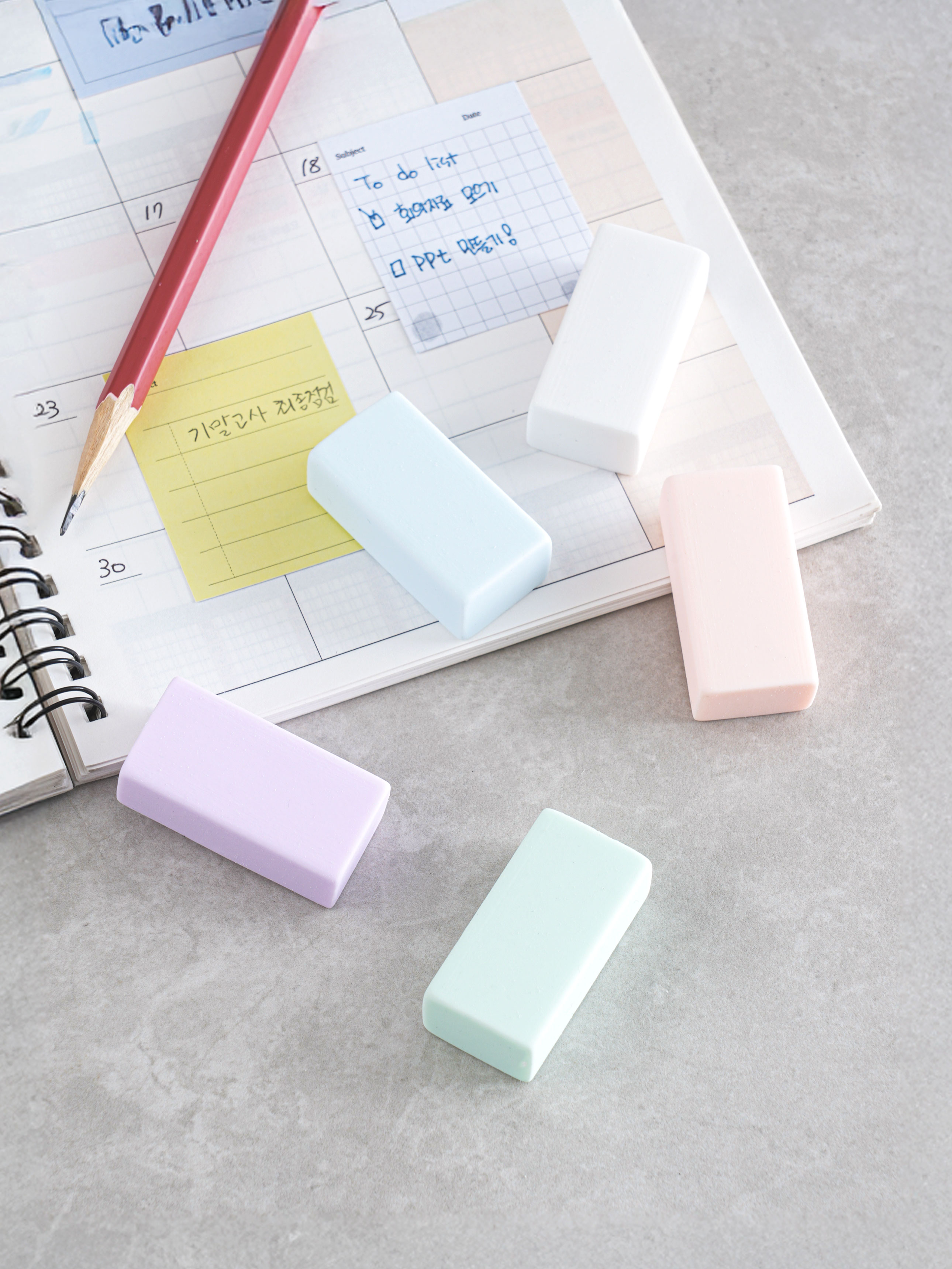 5 pastel erasers with case