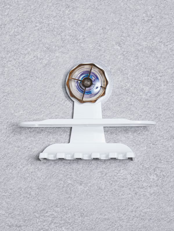 Clear adhesive toothbrush holder