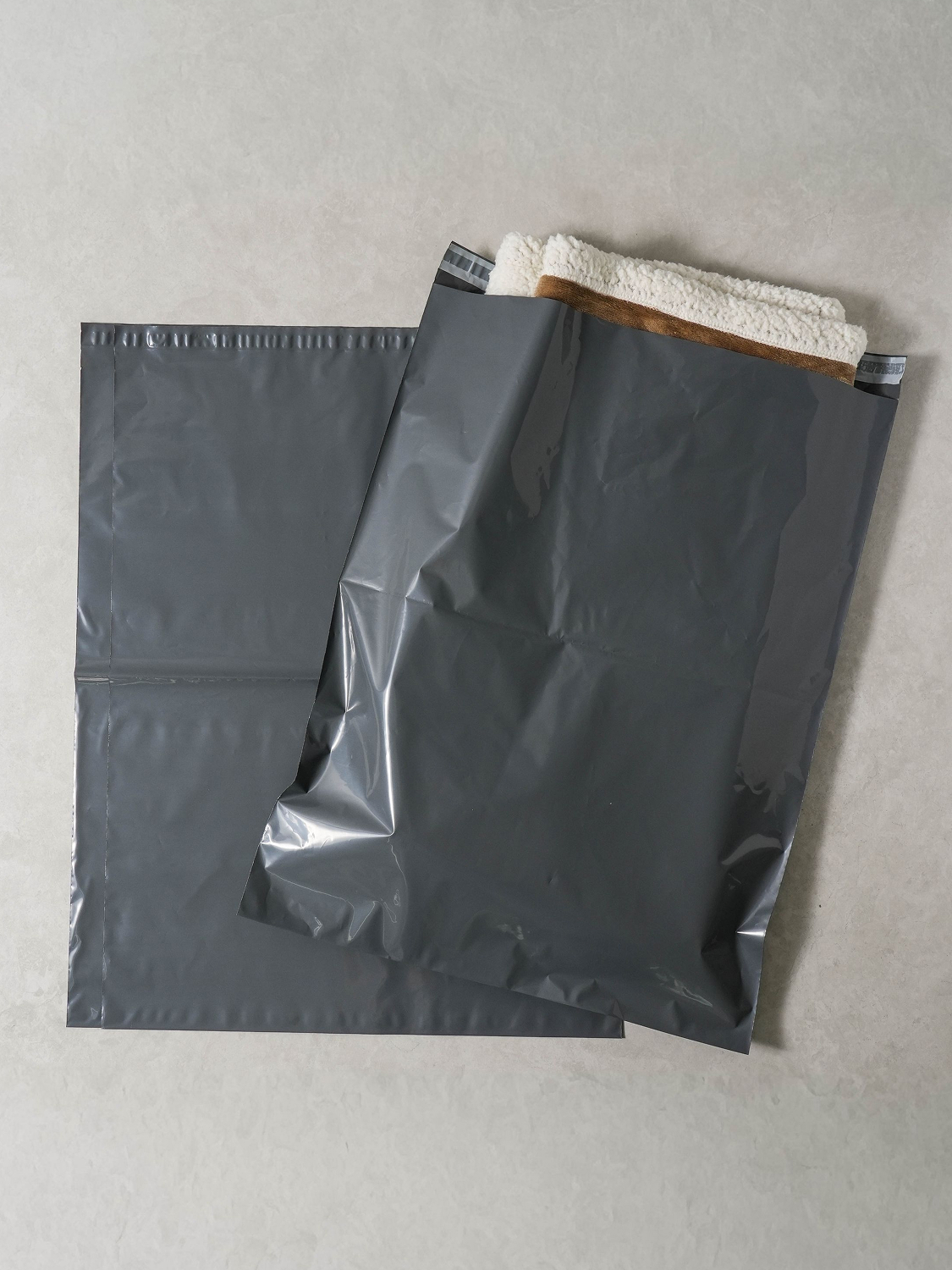 Adhesive delivery envelopes 46