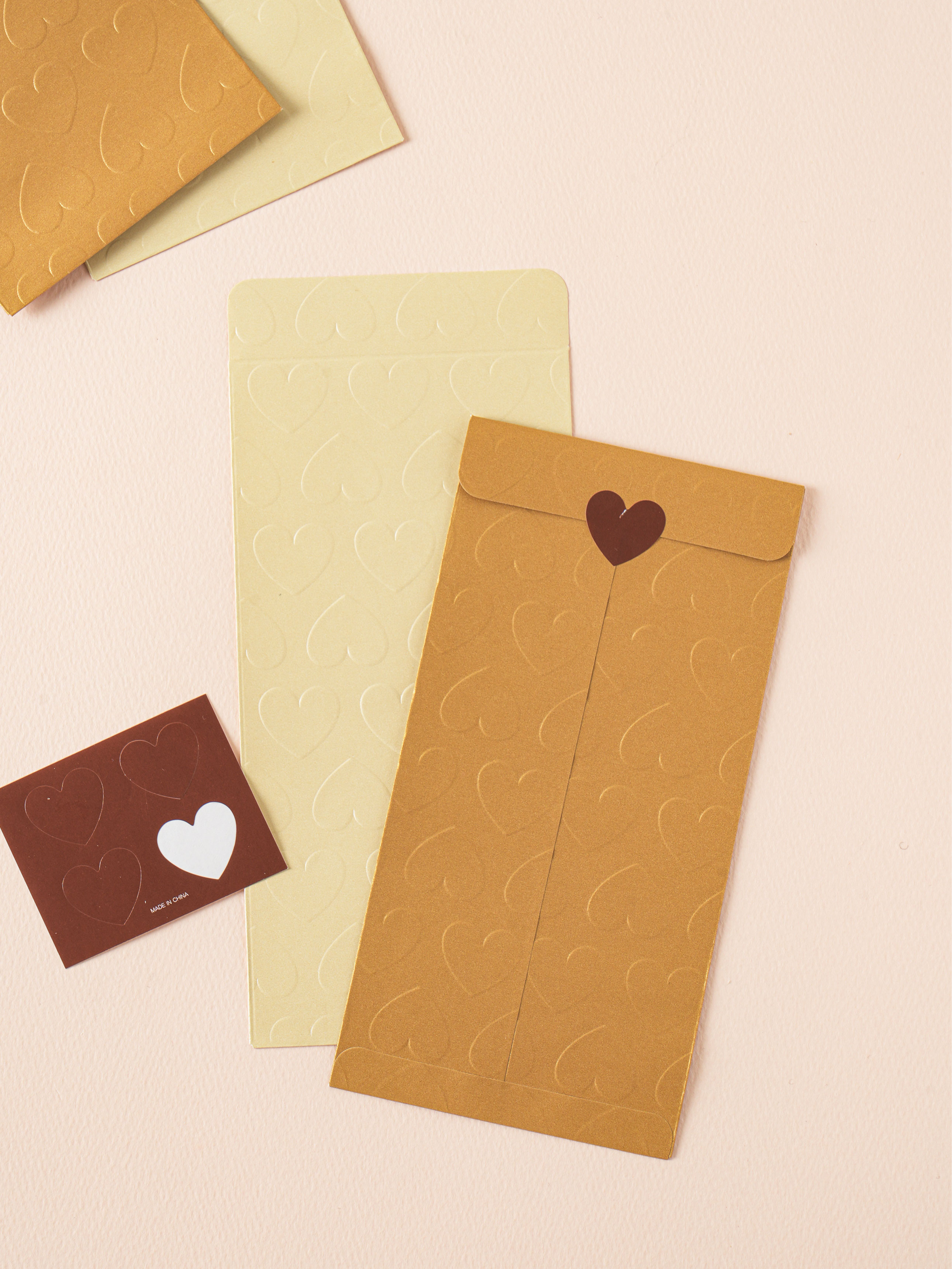 4 heart-pressed money envelopes