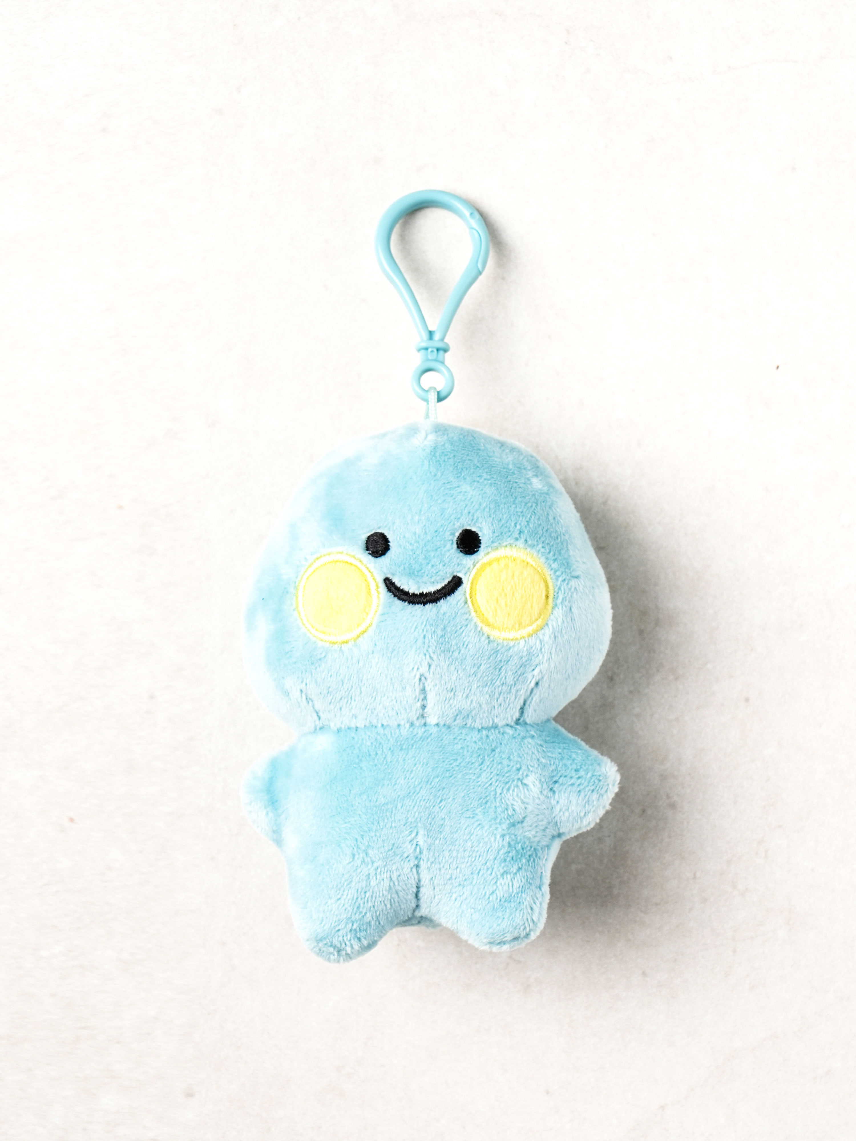 Round dinosaur hanging doll blue