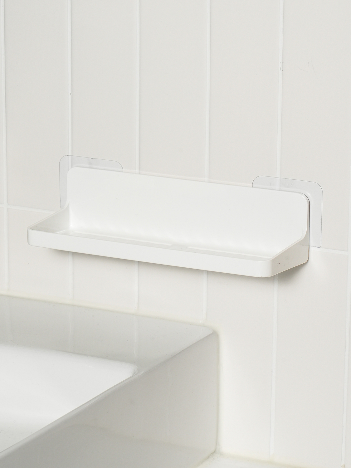 Attachable drainable bathroom shelf