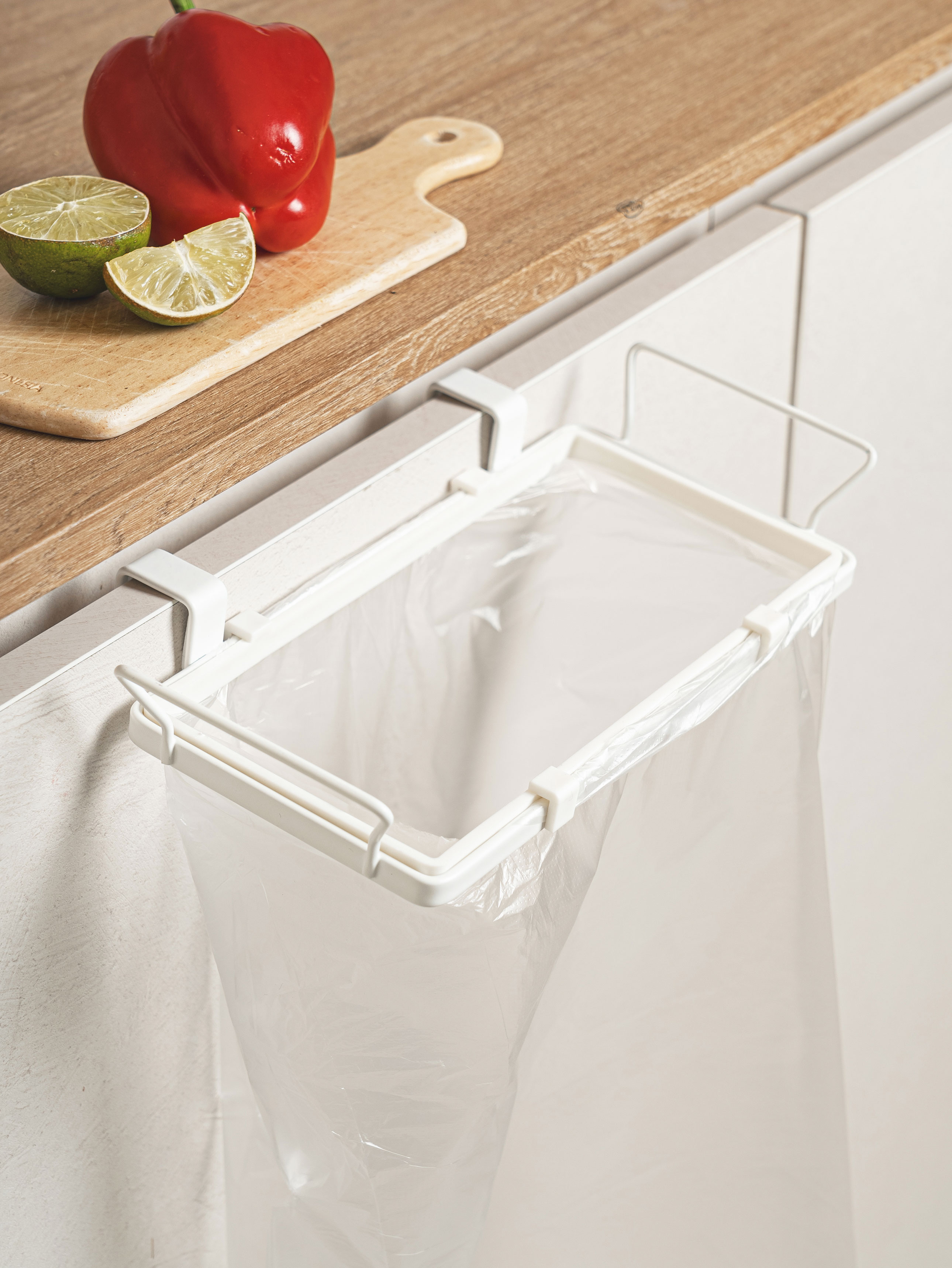 Sink door trash bag hanger