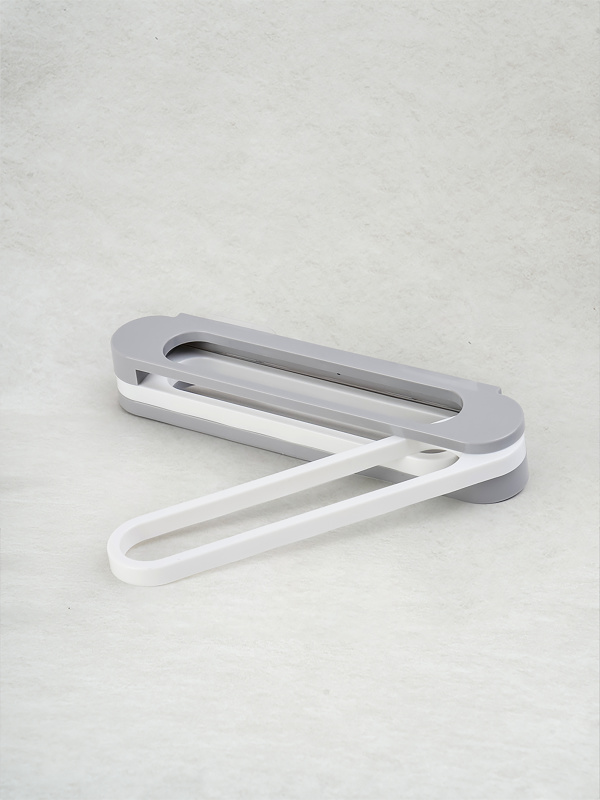 Adhesive bathroom shoe holder