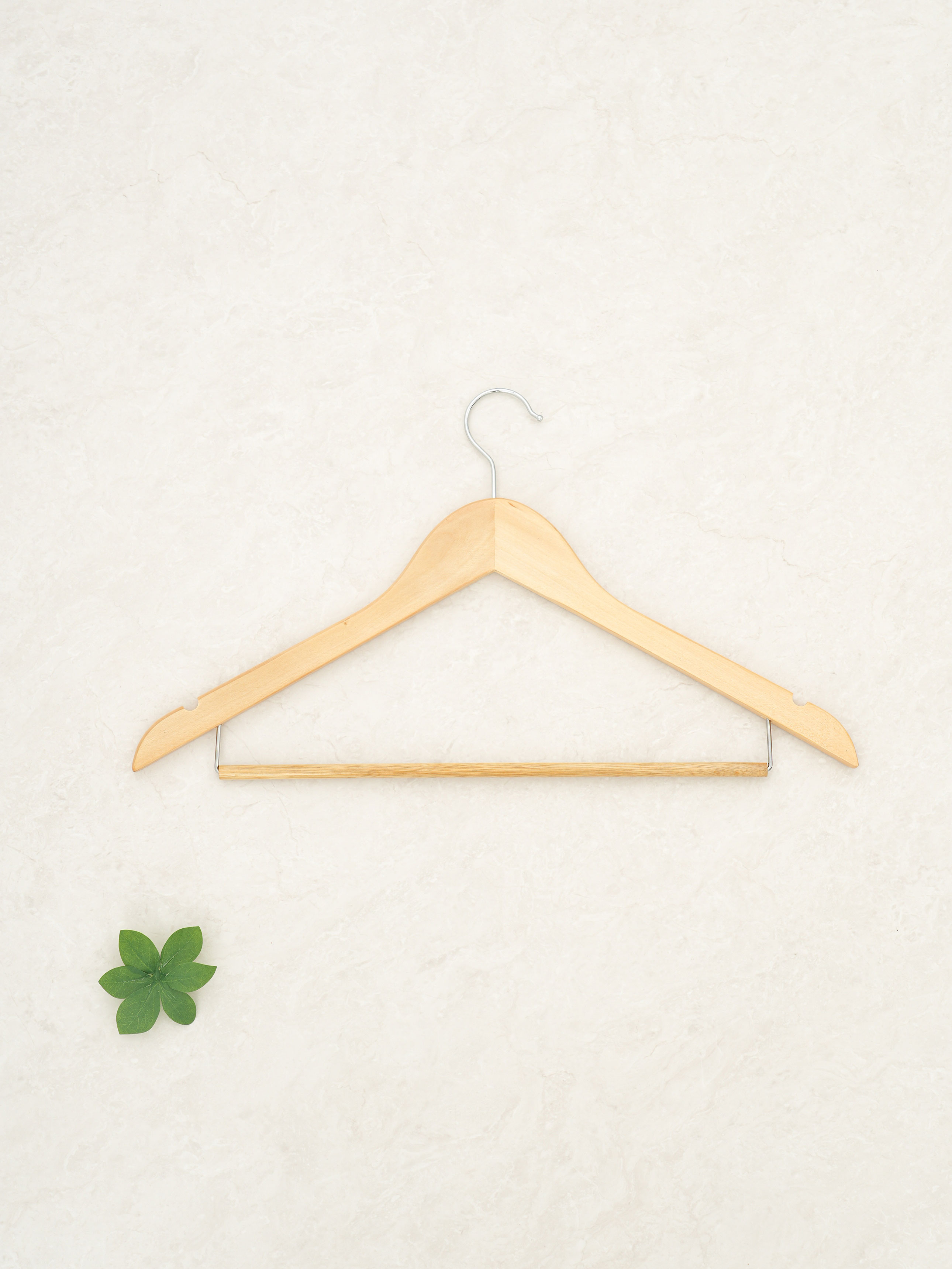 1 wooden hanger that doubles as a trouser hanger