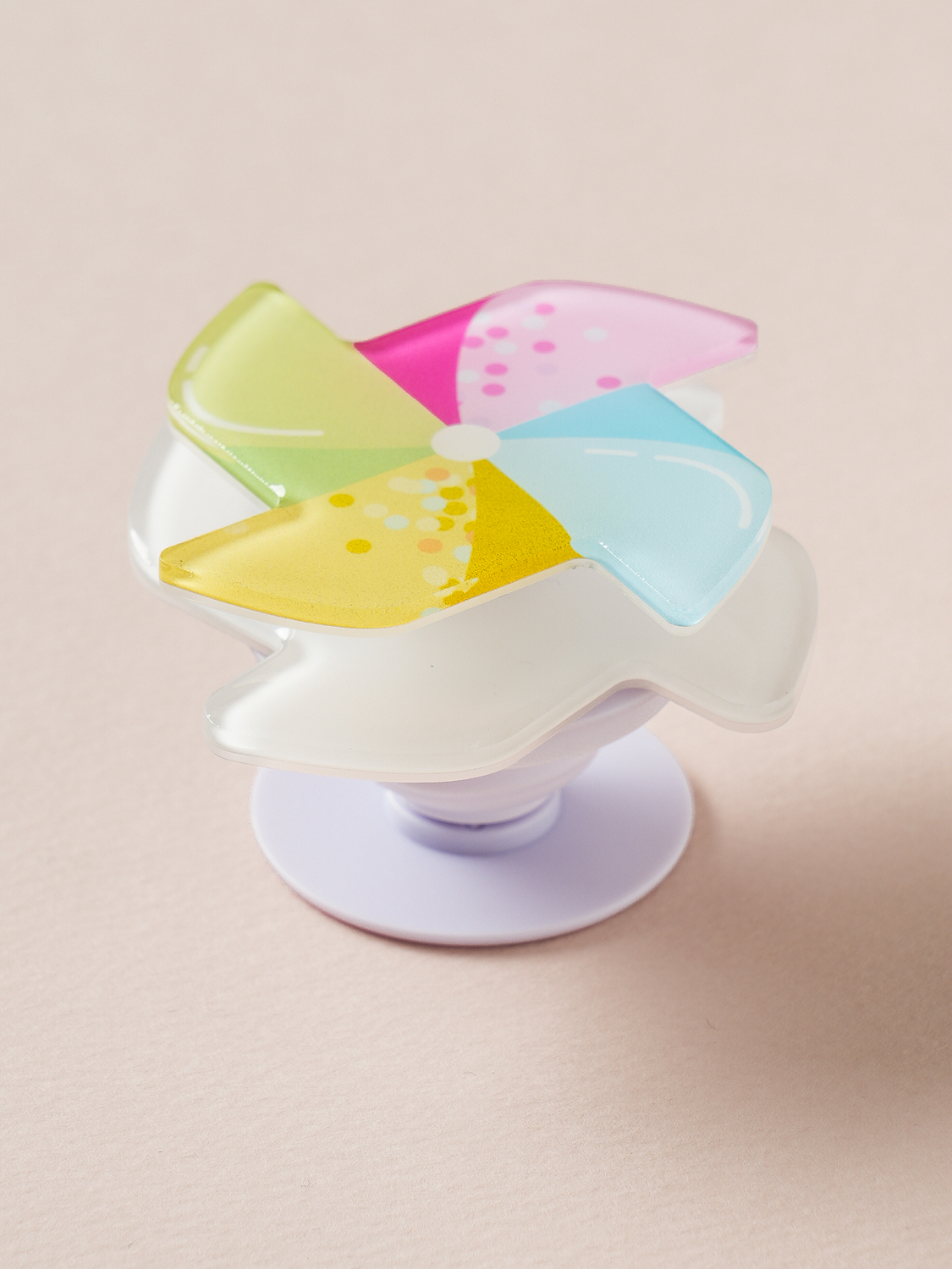 Adhesive rotating pop finger pinwheel