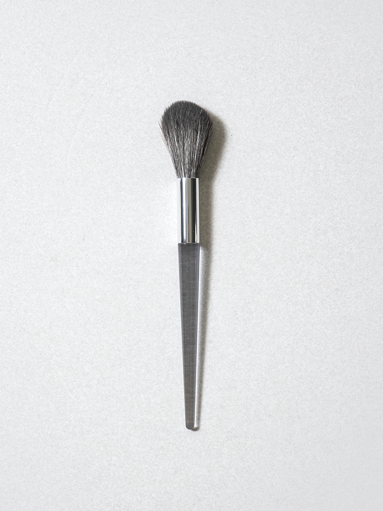 Transparent handle cheek brush