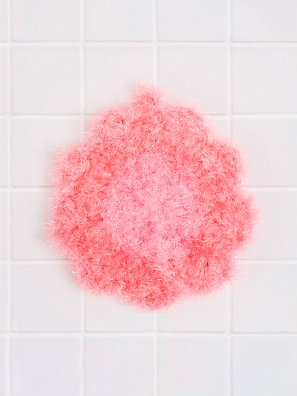 Hand-knitted flower scrubber